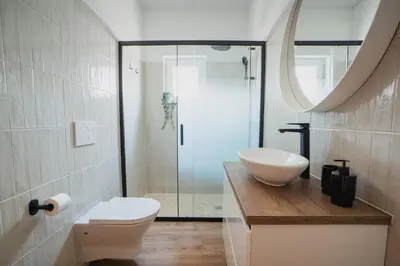 a bathroom with a toilet and a sink and a shower at Casa Calma II - 2 double bedrooms apartment in Luz