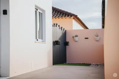 a pivot door in a house with potted plants at Casa da Carreira in Almagreira