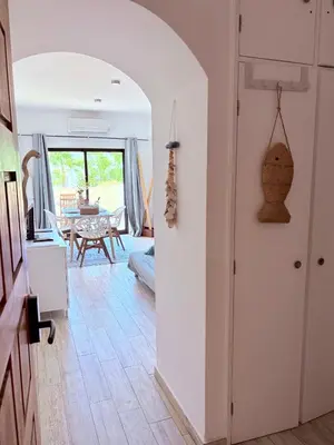 a kitchen with an archway leading to a dining room at Magnolia Studio 303 in Lagos