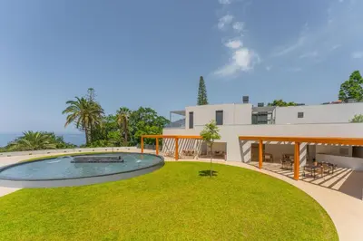 a view of the backyard of a house at FLH Funchal Seaside at Acqua Residences in Funchal