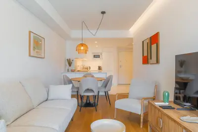 a living room with a couch and a table at FLH Funchal Seaside at Acqua Residences in Funchal