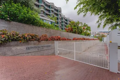 a gate at the entrance to a building at FLH Funchal City View at Quinta da Nogueira Residence in Funchal