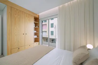 a bedroom with a bed and a window at In Funchal city centre - AL'gria II in Funchal