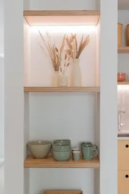 a shelf with bowls and vases on it at In Funchal city centre - AL'gria II in Funchal