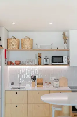 a kitchen with a sink and a microwave at In Funchal city centre - AL'gria II in Funchal