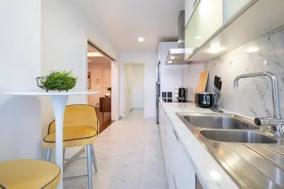 a kitchen with a sink and a counter at Lux City center apartments EX in Funchal