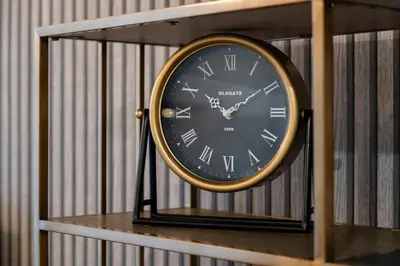a clock sitting on top of a shelf at Lux City center apartments EX in Funchal