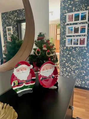 two santa claus chairs on a table in front of a mirror at Rodamar Apartment Forum Funchal in Funchal