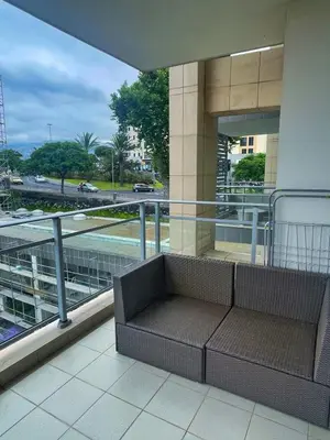a balcony with a bench on top of a building at Rodamar Apartment Forum Funchal in Funchal