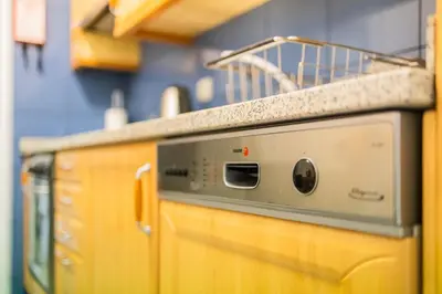 a kitchen with an oven with a counter top at Ivory Breeze by Elysian in Funchal