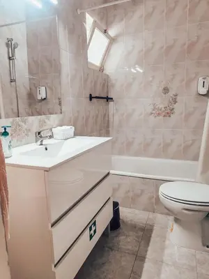 a bathroom with a sink and a toilet and a tub at Villa Victoria, Tonel, Sagres in Sagres