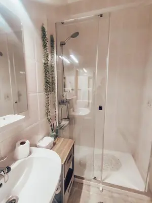 a bathroom with a shower and a sink and a tub at Villa Victoria, Tonel, Sagres in Sagres
