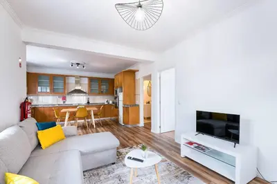 a living room with a couch and a tv at Crab House 01 by GALMI in Machico