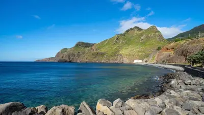 a view of a beach with mountains in the background at Crab House 02 by GALMI in Machico