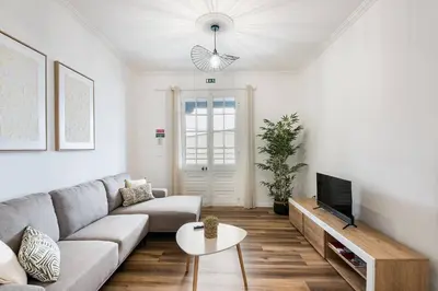 a living room with a couch and a tv at Crab House 02 by GALMI in Machico