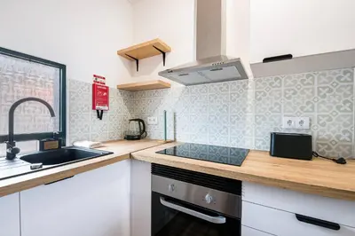 a kitchen with a sink and a counter top at Crab House 02 by GALMI in Machico