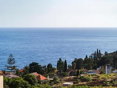 a view of the ocean from a hill at Villa Getaway in Santo António da Serra in Santo da Serra