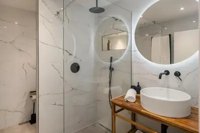 a bathroom with a sink and a mirror at Casa Branca 36 by An Island Apart in Funchal