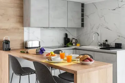 a kitchen with a wooden table with food on it at Casa Branca 36 by An Island Apart in Funchal