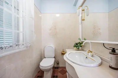 a bedroom with two beds and a lamp on a night stand at Ocean Side Vista by YOUR KEY in Funchal