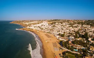 an aerial view of a beach and the ocean at Topside Luz Guesthouse in Luz