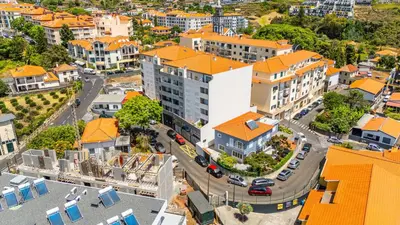 an aerial view of a city with buildings at Amethyst Scape Caniço Madeira by GRM in Caniço