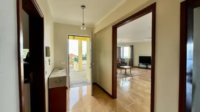 a hallway with a door leading to a living room at Golden View in Gaula