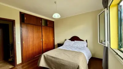 a small bedroom with a bed and a closet at Golden View in Gaula
