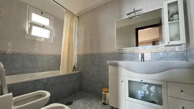 a bathroom with a sink and a toilet and a mirror at Golden View in Gaula