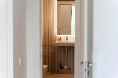 a bathroom with a sink and a mirror at GuestReady - Acqua residences in Funchal
