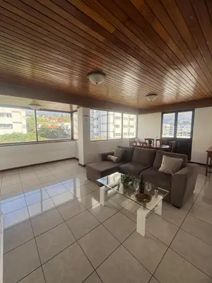 a living room with a couch and a table at My Sun Holidays in Funchal