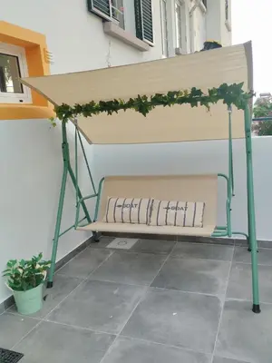 a bench with a table on top of it at Villa Baía in Funchal