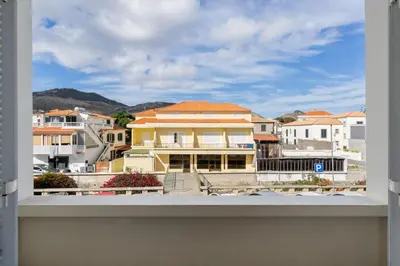 a view of a city from a balcony at Apartamento da Vila by An Island Apart in Porto Santo
