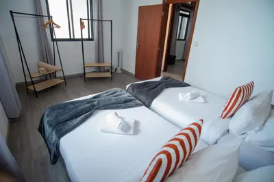 two twin beds in a room with at Apartment II Estrela da Calheta in Calheta