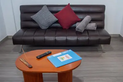 a living room with a couch and a coffee table at Apartment II Estrela da Calheta in Calheta