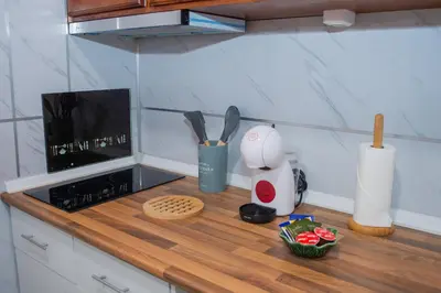 a kitchen counter with a counter top with utensils at Apartment II Estrela da Calheta in Calheta