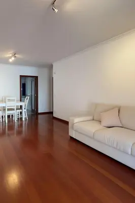 a living room with a white couch and a table at Seavale Apartement in Funchal