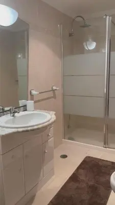 a bathroom with a sink and a shower at Seavale Apartement in Funchal