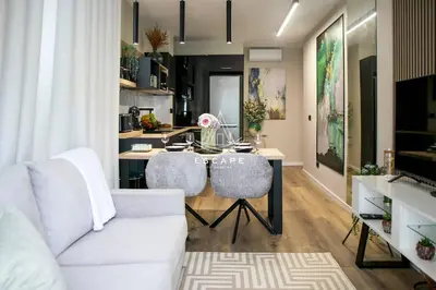 a hotel room with a bed with towels on it at Lobos Dream Flat by Escape to Madeira in Câmara de Lobos