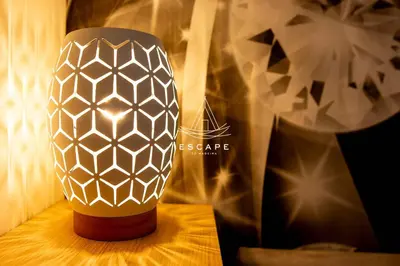 a vase sitting on top of a table at Lobos Dream Flat by Escape to Madeira in Câmara de Lobos