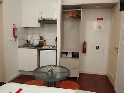 a small kitchen with a glass table in a room at Bella Vista in Funchal