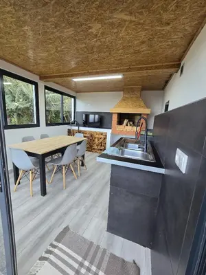 a kitchen and dining room with a sink and a table at casa Farraia in Santana