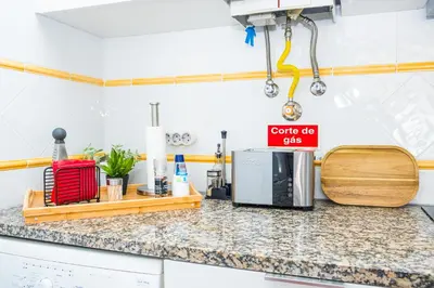 a kitchen with a counter top with a microwave at StayinMachico in Machico