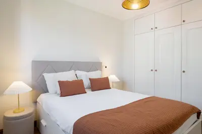 a bedroom with a large white bed with two pillows at Vila Formosa III by An Island Apart in Funchal