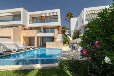 an image of a house with a swimming pool at Som do Mar Luxury Ocean Front Villa in Luz