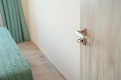 an open door with a bed in a room at Infinite Sea in Funchal