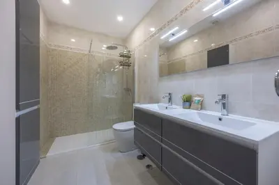 a bathroom with a sink and a shower and a toilet at Apartment do Ramses in Luz