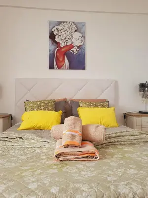 a bed with two pillows on top of it at HOME Funchal Personal 2 in Funchal