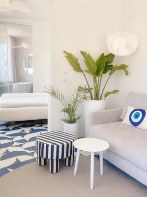 a living room with a couch and a table at Ocean Apartment by ENDLESS SUN I modern comfort, sea view, wi-fi, parking, heating in Lagos