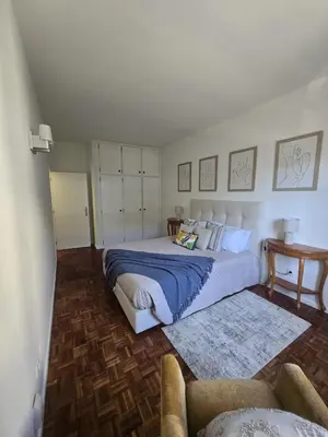 a bedroom with a large bed and a couch at The Empress Atlantic Stay Free Parking in Funchal